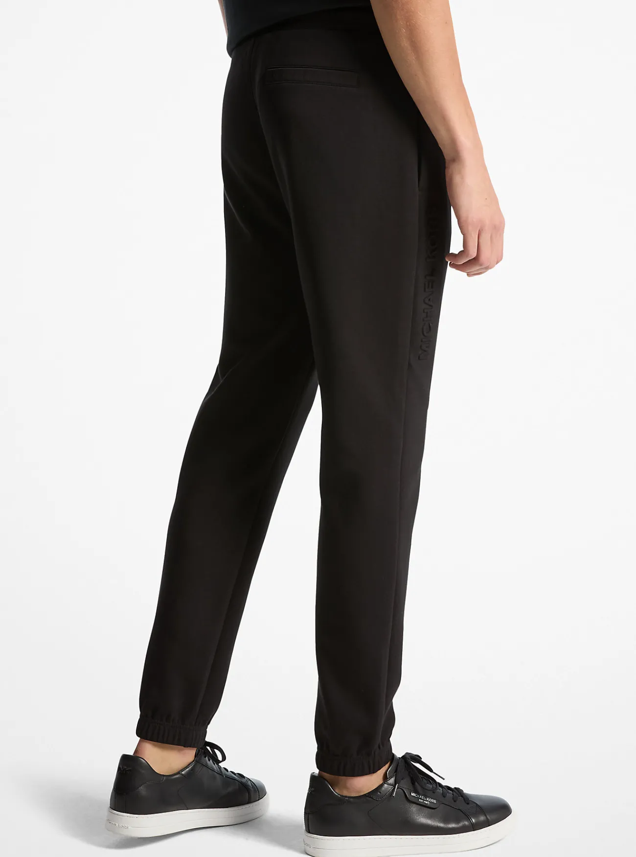 Michael Kors Joggingbroek van katoenmix met logo in reli&euml;f ZWART Online