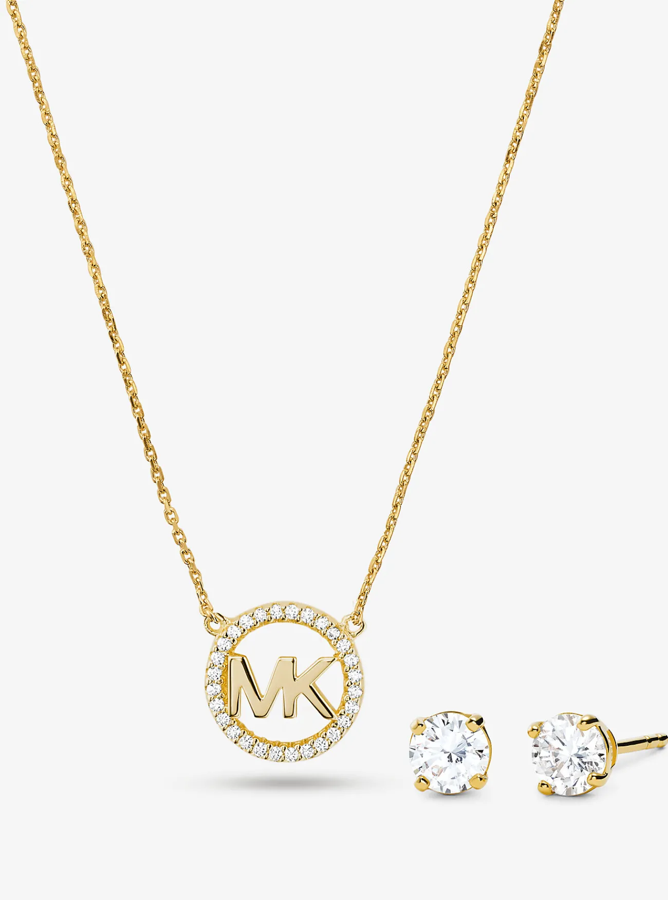 Michael Kors Set van halsketting en oorknopjes van sterlingzilver met plating met 14K ros&eacute; en logobedel met siersteentjes GOUD Online